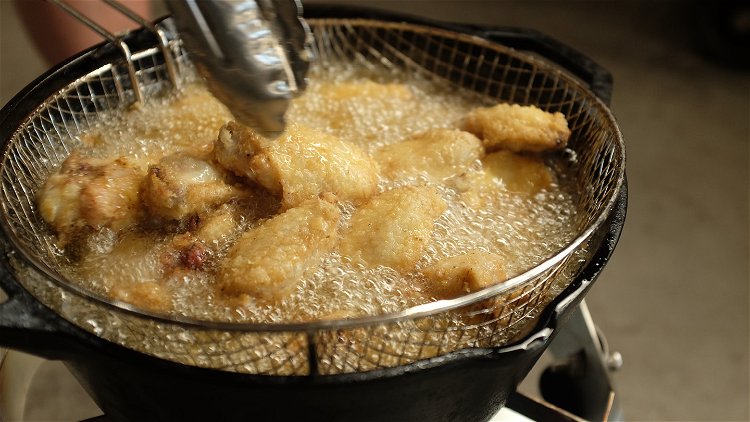 Image of Fry the wings until cooked through (165ºF internal), about 9...
