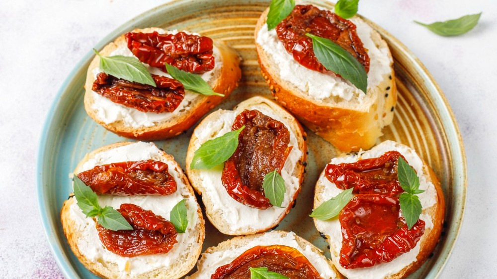 Image of Toasts with almond cream cheese and dried tomatoes