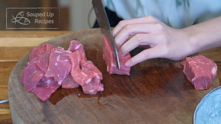 Image of Slice the beef into 1/4 of an inch thick slices. New York strip, flank steak, and rib-eye work well for this recipe.