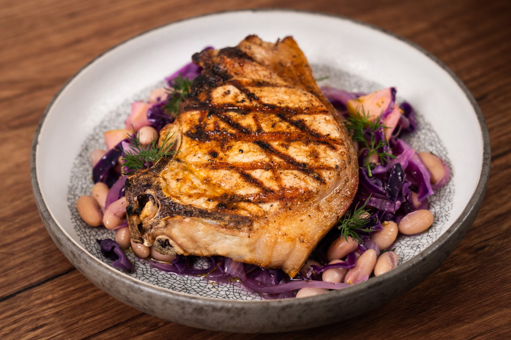 Pork chop with white beans, rosemary and apple