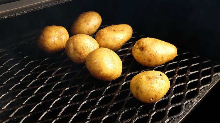 Image of Transfer potatoes to the second shelf of the grill and...