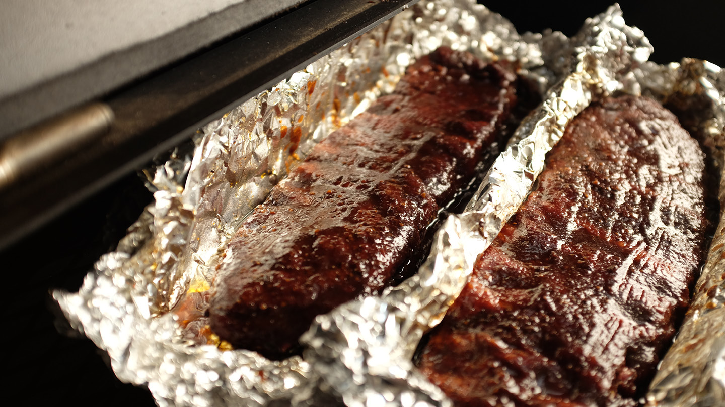 Image of When the ribs are tender flip them over to sit...