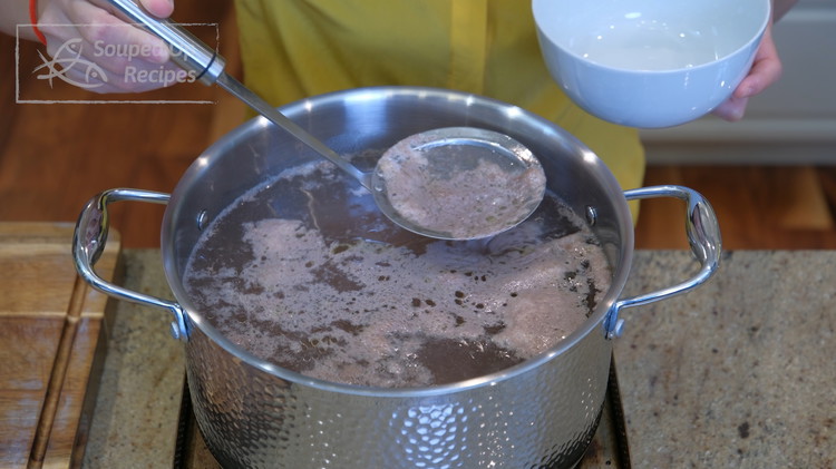 Image of Once the beef pot boils, skim off all the scum using a fine sieve.