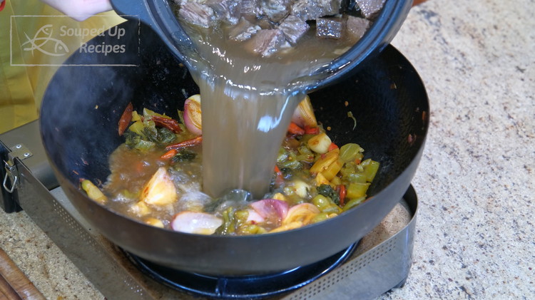 Image of Last, pour in the beef along with all the broth. Bring it to a simmer and let it cook for 10 minutes so everything can mingle together. We don't want to braise the mustard green for too long; otherwise, you...