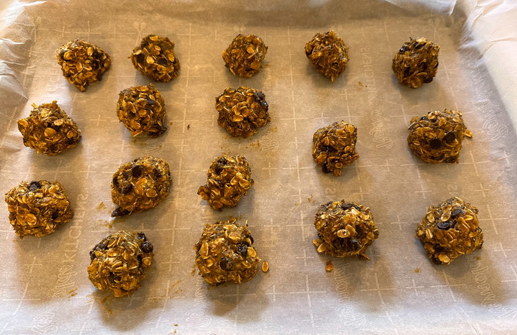 Image of Cover a cookie sheet with a piece of wax paper, then take large spoonfuls of your mixture with your hands and roll them into balls, placing them on your parchment paper. Repeat until the dough is gone, then refrigerate or...