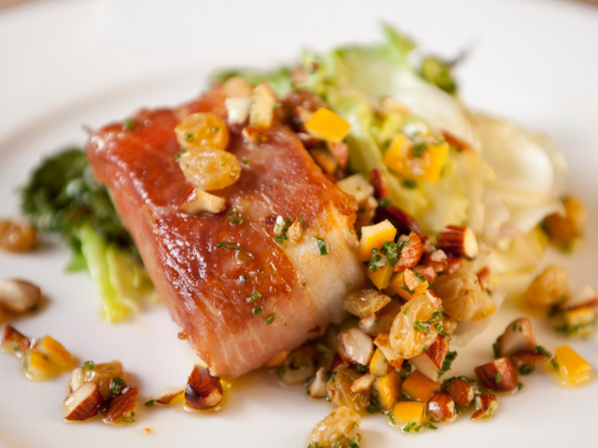  Prosciutto-Wrapped Halibut over Couscous with shaved Brussels Sprouts