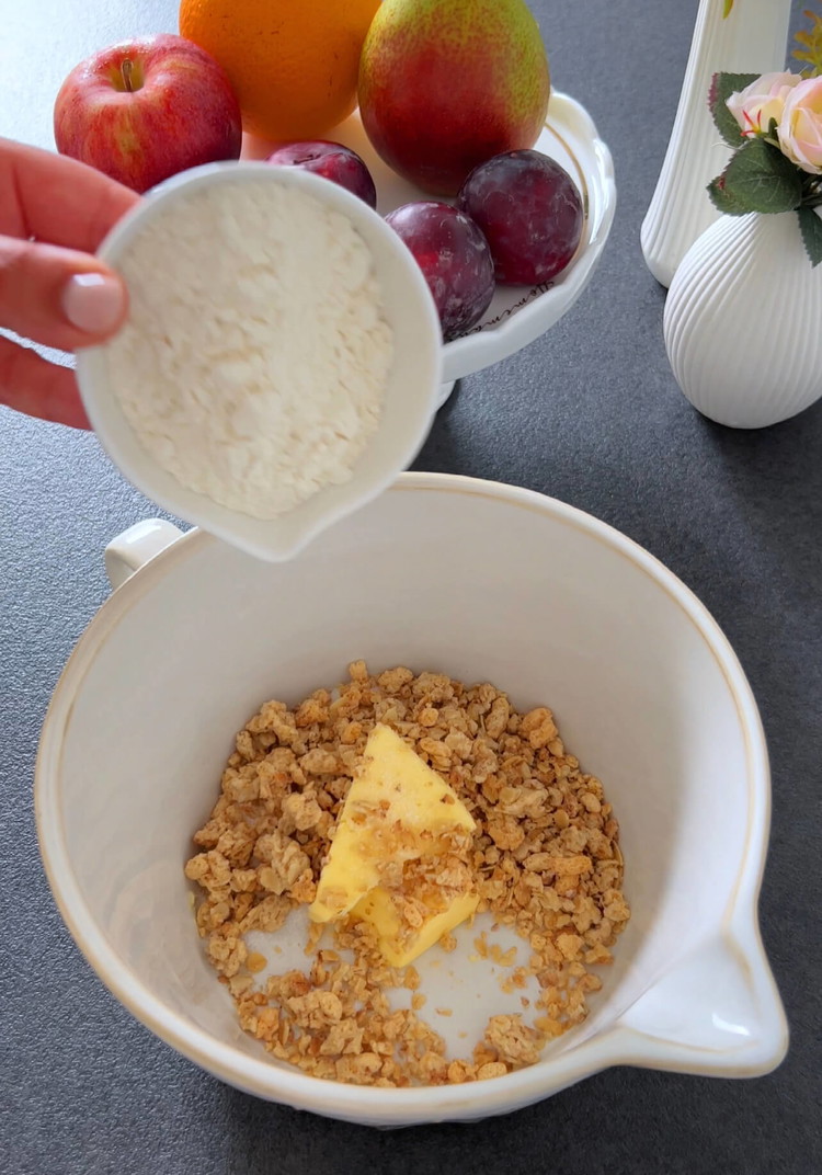 Image of Place the diced apples, pears, and plums into a baking dish.
