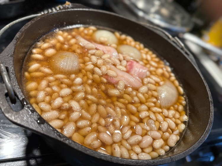 Image of Roll your bacon (or salt pork) up into a pinwheel shape and place it in the center of your beans (it’s okay if the bacon doesn’t stay in the shape).