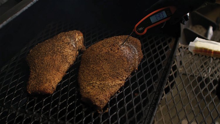 Image of Transfer the seasoned turkey breasts to the smoker, with the...