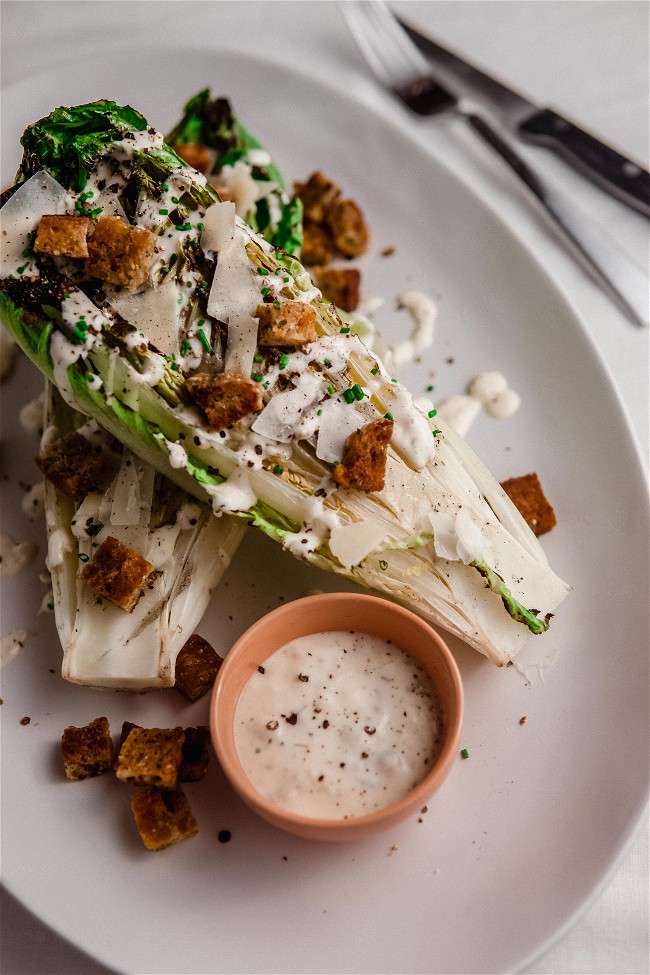 Image of Umami Caesar Dressing on Grilled Romaine Salads