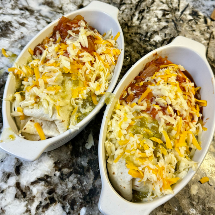 Image of Roll and top half with the green sauce and half with the red sauce. Sprinkle shredded cheese on top. 