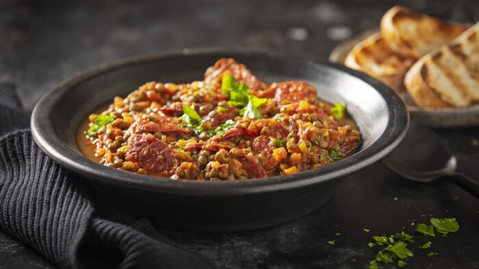 Image of Grilled chorizo with green lentils, garlic and tomato