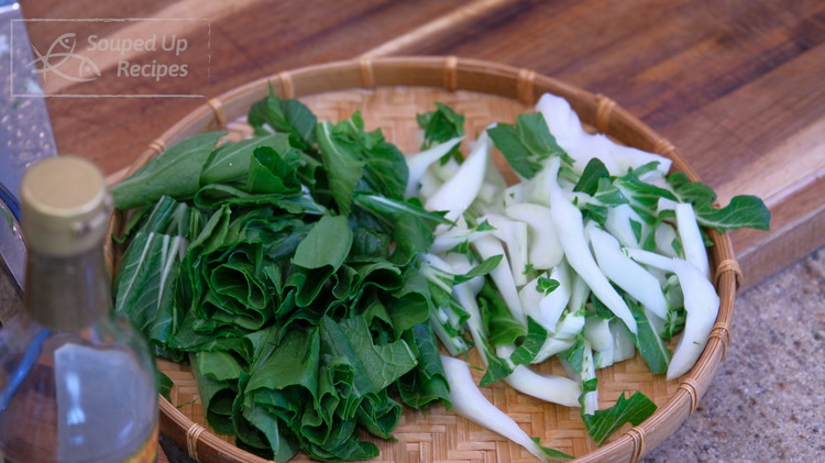 Image of Cut the big bok choy into bite-size pieces. Separate the stem and leaves. Any leafy vegetables that have crunchy stems will work, such as turnip green, mustard green, daikon cabbage, and Chinese broccoli.