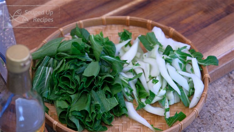 Image of Cut the big bok choy into bite-size pieces. Separate the...