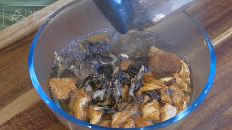 Image of Soak the mushrooms in hot water for 15 minutes. Any type will work. If you use fresh mushrooms, please skip the soaking step. 