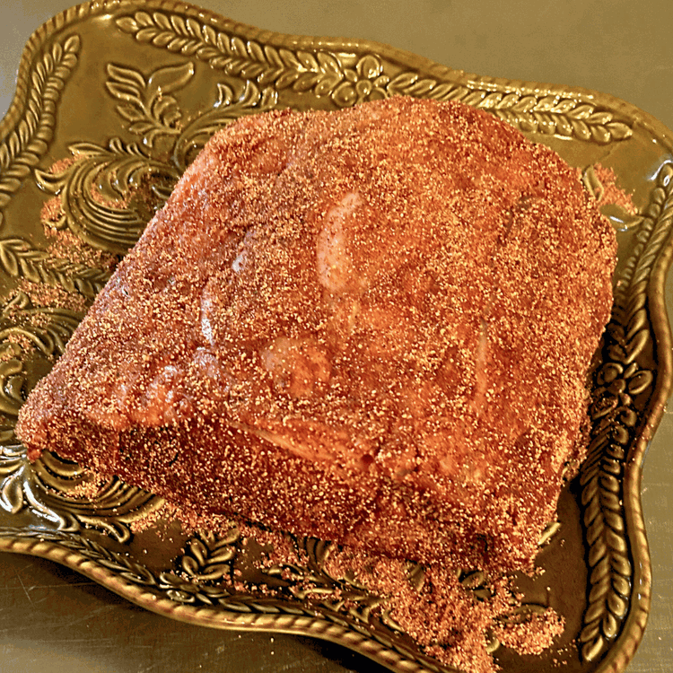 Image of Rub the spice mixture evenly over the surface of your boneless bison rib roast. Be sure to coat all sides for maximum flavor.