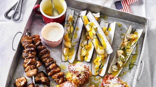 Image of Chicken skewers, razor clams and grilled corn with nduja butter