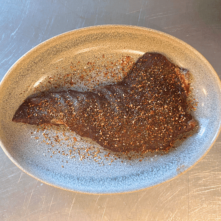 Image of Rub the trimmed tri tip with steak seasoning until it's fully coated. Allow the roast to rest for approx. 30 more minutes 