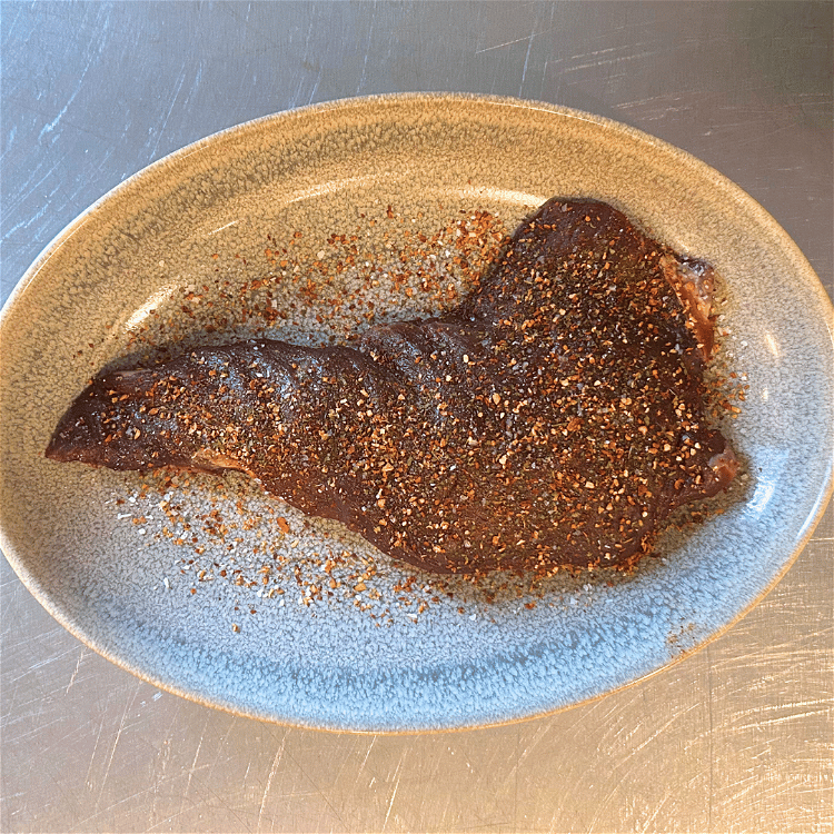 Image of Rub the trimmed tri tip with steak seasoning until it's...