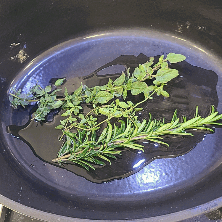 Image of Get out your favorite dutch oven and heat it over medium heat with 2 tbsp of olive oil. While the oil heats, add in the rosemary, oregano and thyme to release their flavors.