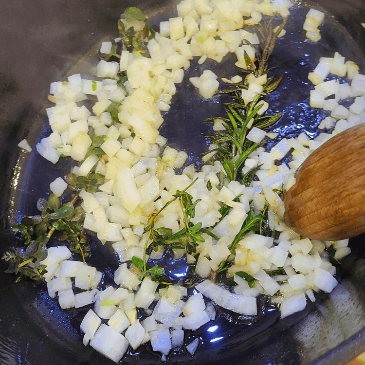 Image of Add in the onions and celery and saute until the edges start to caramelize.