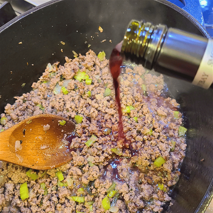 Image of Once the meat is cooked through, deglaze the pot with...