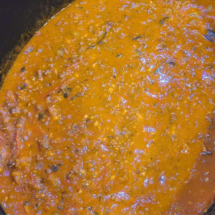 Image of Pour the sauce into the meat mixture and still well. Simmer uncovered over med/low heat for about 30 minutes to reduce to a nice thick sauce. Stir occasionally to be sure it doesn’t stick to the bottom.