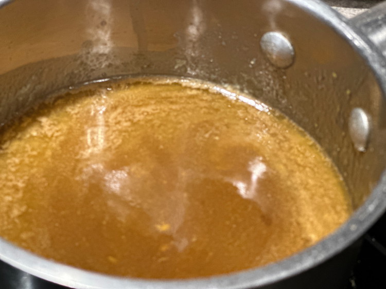 Image of In a small saucepan, add butter, Wood's Maple Syrup, Worcestershire, and Wood's Mustard. Bring to a boil, stir, and simmer.