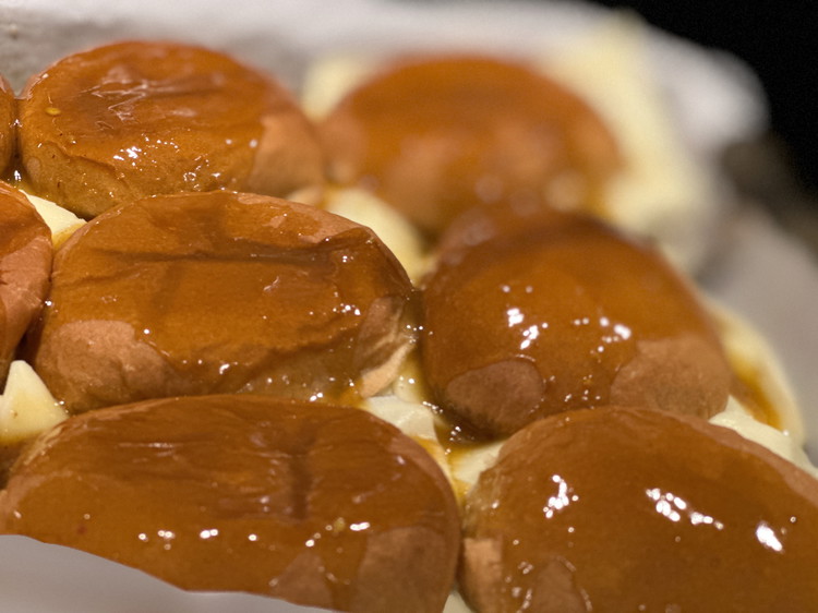Image of Spoon your glaze over the tops of your buns until it’s gone.