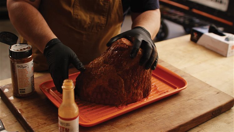 Image of Slather your ham with about two tablespoons Cattleman’s Grill Pit...