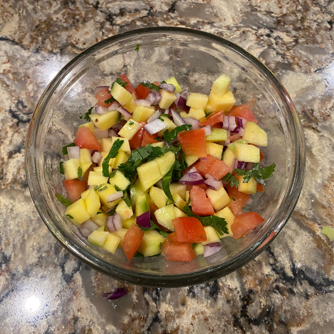 Image of To make the mango salsa, combine all the ingredients under...