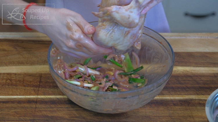 Image of Remove the aromatics from the Cornish hen. There will be some extra marinade left in the bowl. Don’t throw it; we will use that later.