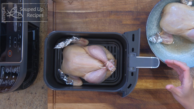Image of Place the Cornish hen in the Air fryer basket. Set the temperature to 300F without preheating and let it cook for 35 minutes. It may look like a short time but trust me, it is enough to cook the chicken...