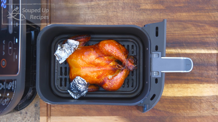 Image of The downside of the air fryer is that you can only cook one chicken at a time because the basket is small. If you cook more than one, you will have to use an oven. 