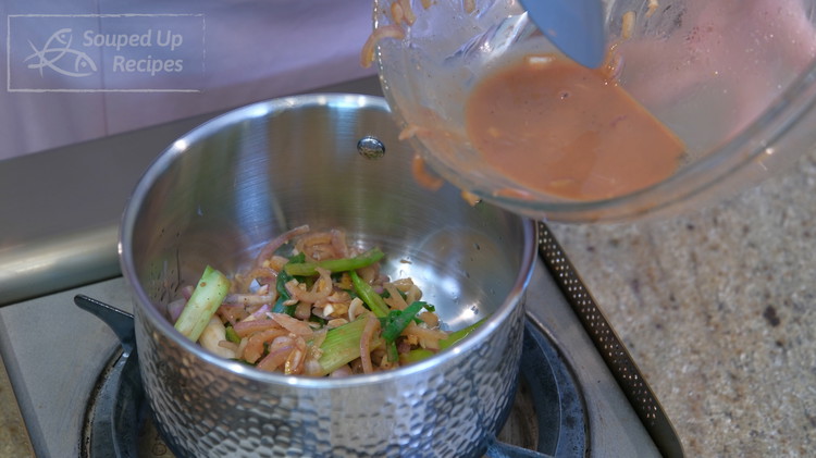 Image of During the roasting, you can work on gravy. Add 1 tbsp of oil to a saucepan. Put the aromatic from the leftover marinade into the saucepan, but leave the liquid behind.
