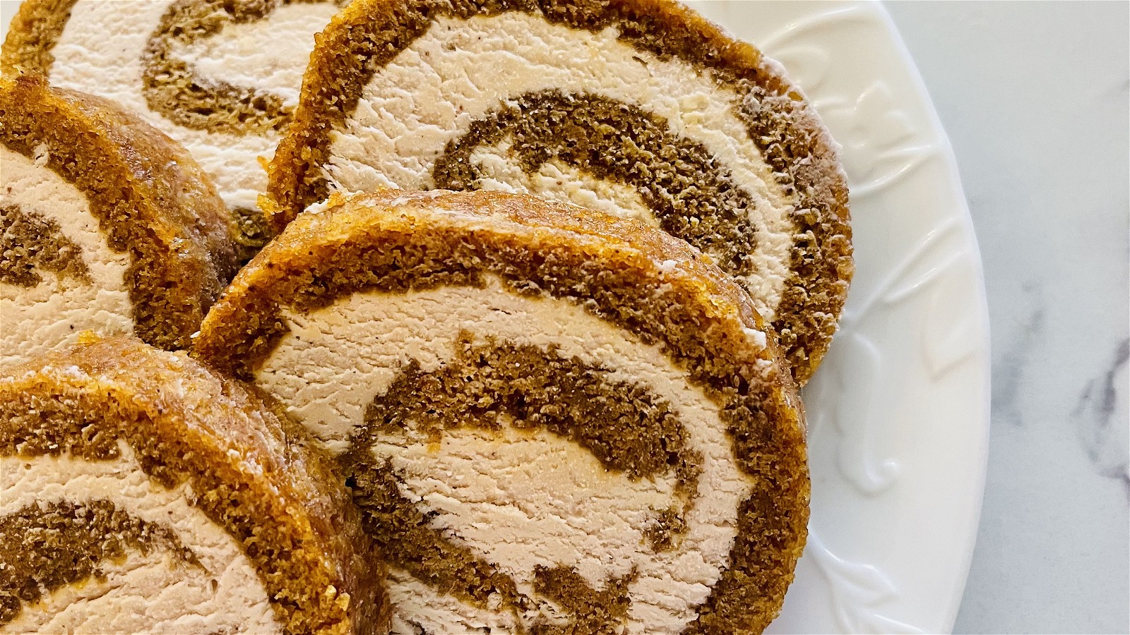 Image of The Best Pumpkin Roll With Elderberry Cream Cheese Frosting