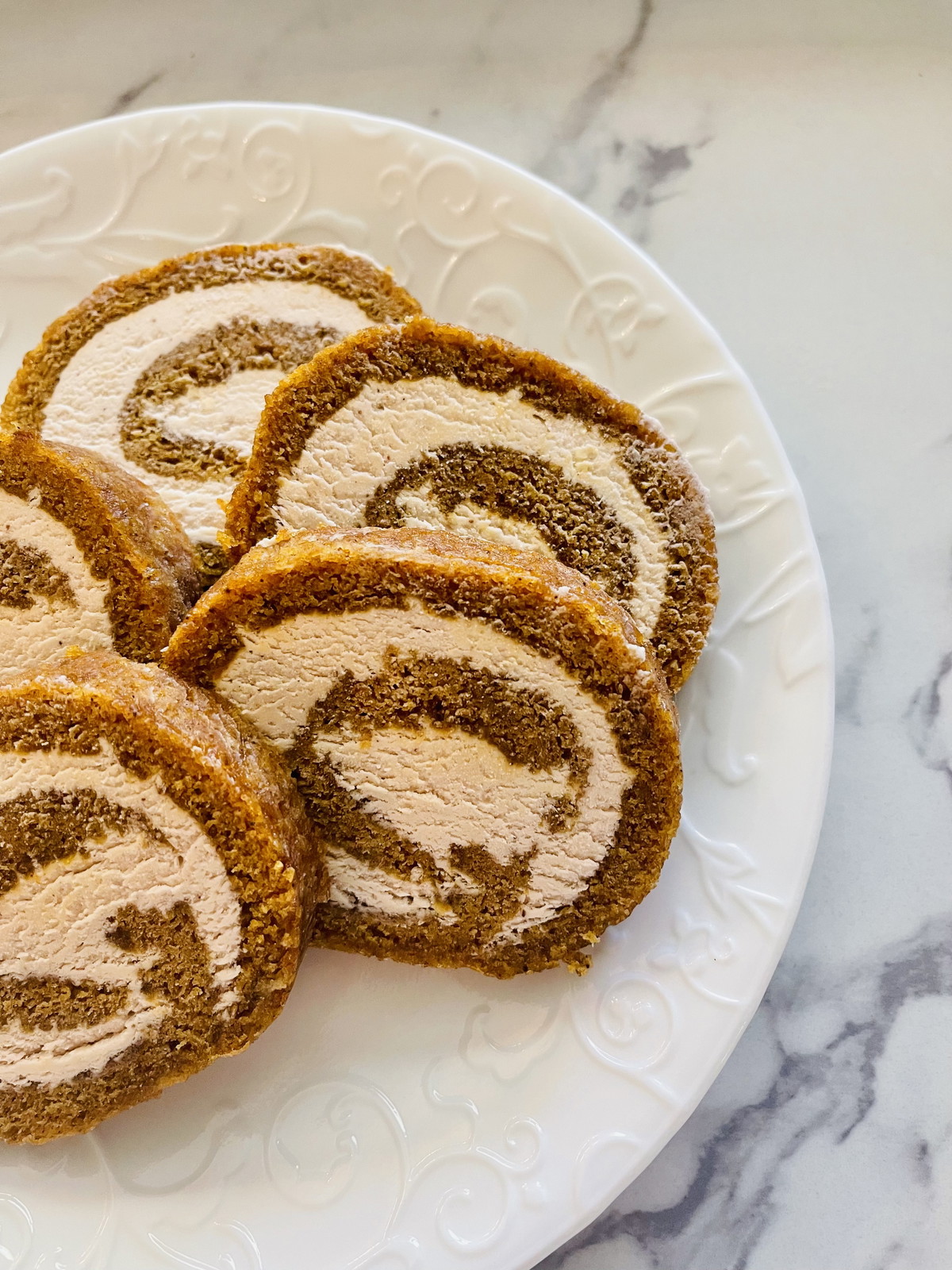 The Best Pumpkin Roll With Elderberry Cream Cheese Frosting
