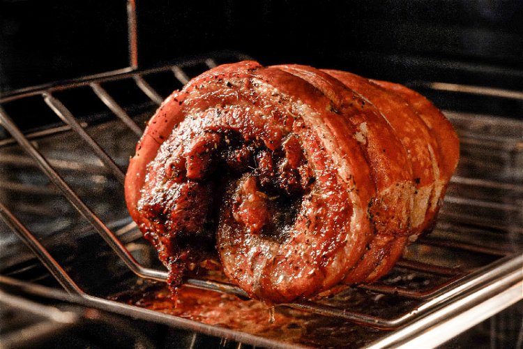 Image of Continue roasting until the inside of the pork is tender....