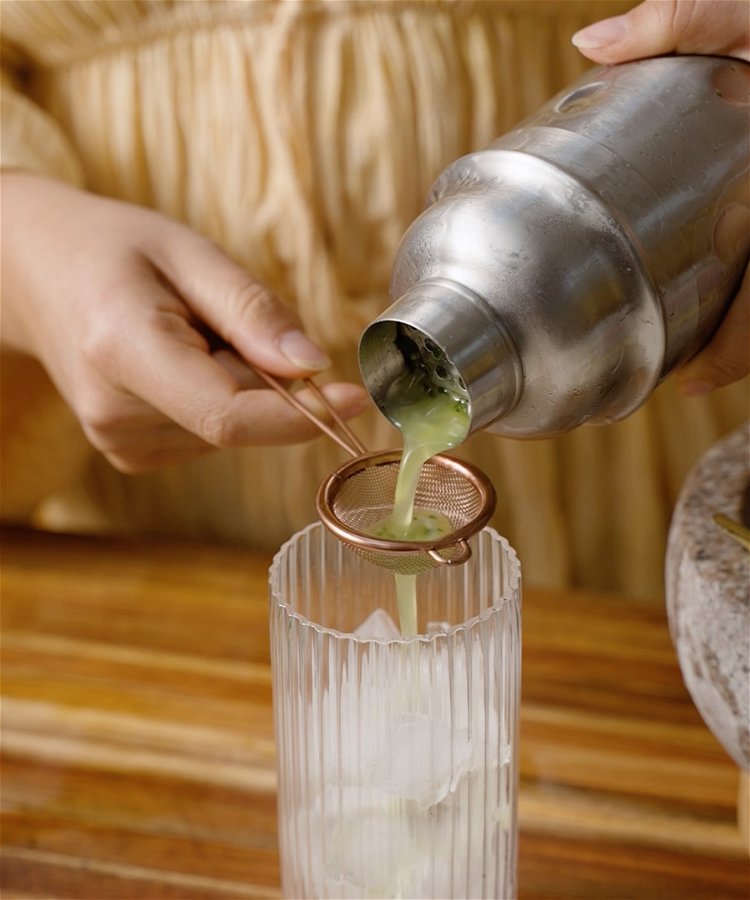 Image of Use a filter to pour from shaker into a glass...