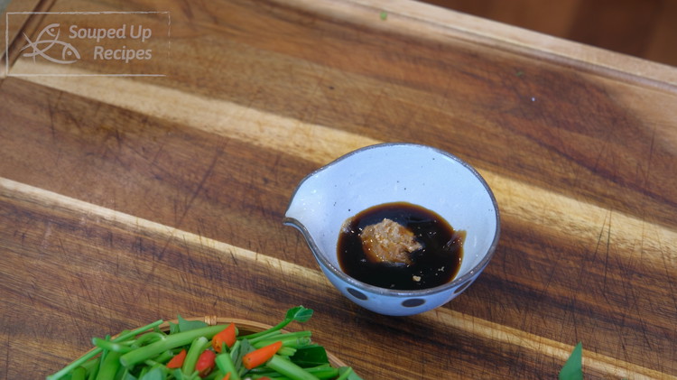 Image of In a bowl, add cornstarch, soy sauce, oyster sauce, and fermented bean curd and mix well. If you don’t have fermented bean curd, use a tsp of miso paste or Korean soybean paste as a replacement.