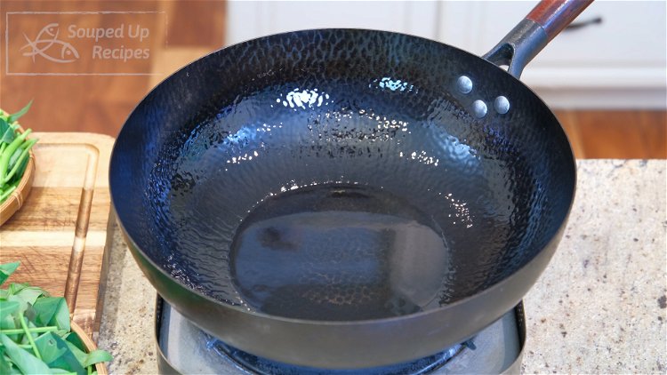 Image of Heat the wok until smoking hot. Add a big drizzle...