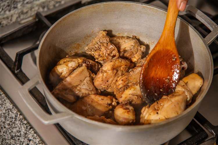 Image of In a heavy-bottomed pot, heat the oil. Add the sugar...