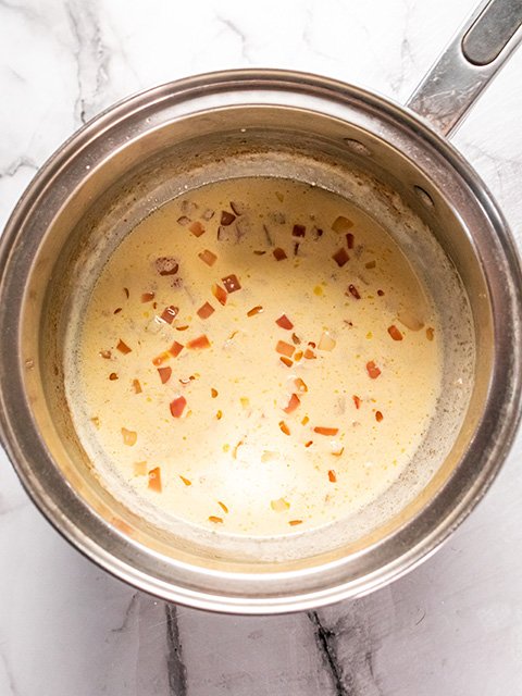 Image of Slowly whisk in heavy cream and bring to a low...