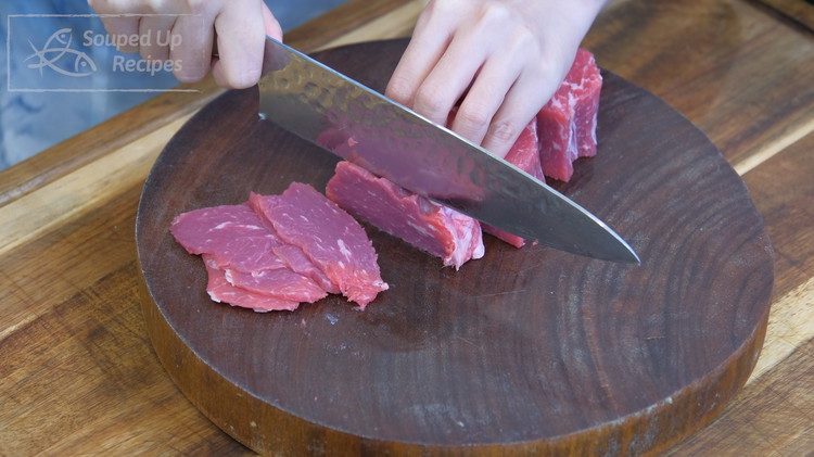 Image of Slice the beef into 1/8 of an inch thick slices. I recommend using the New York strip, flank steak, or sirloin cap. 