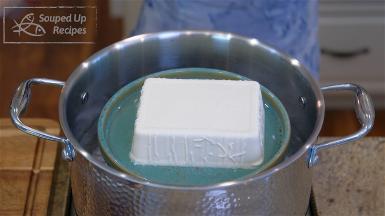 Image of Pre-boil a pot of water and steam the tofu over...