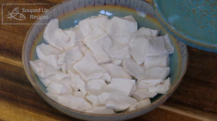 Image of Once done, take the tofu out and use a spoon to scoop the tofu into a serving plate. The purpose is to create more surface area, which allows the seasonings to infuse deeper.