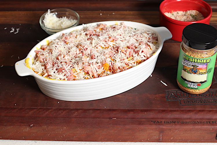 Image of lastly diced bacon and a light coat of grated cheddar with some pecorino