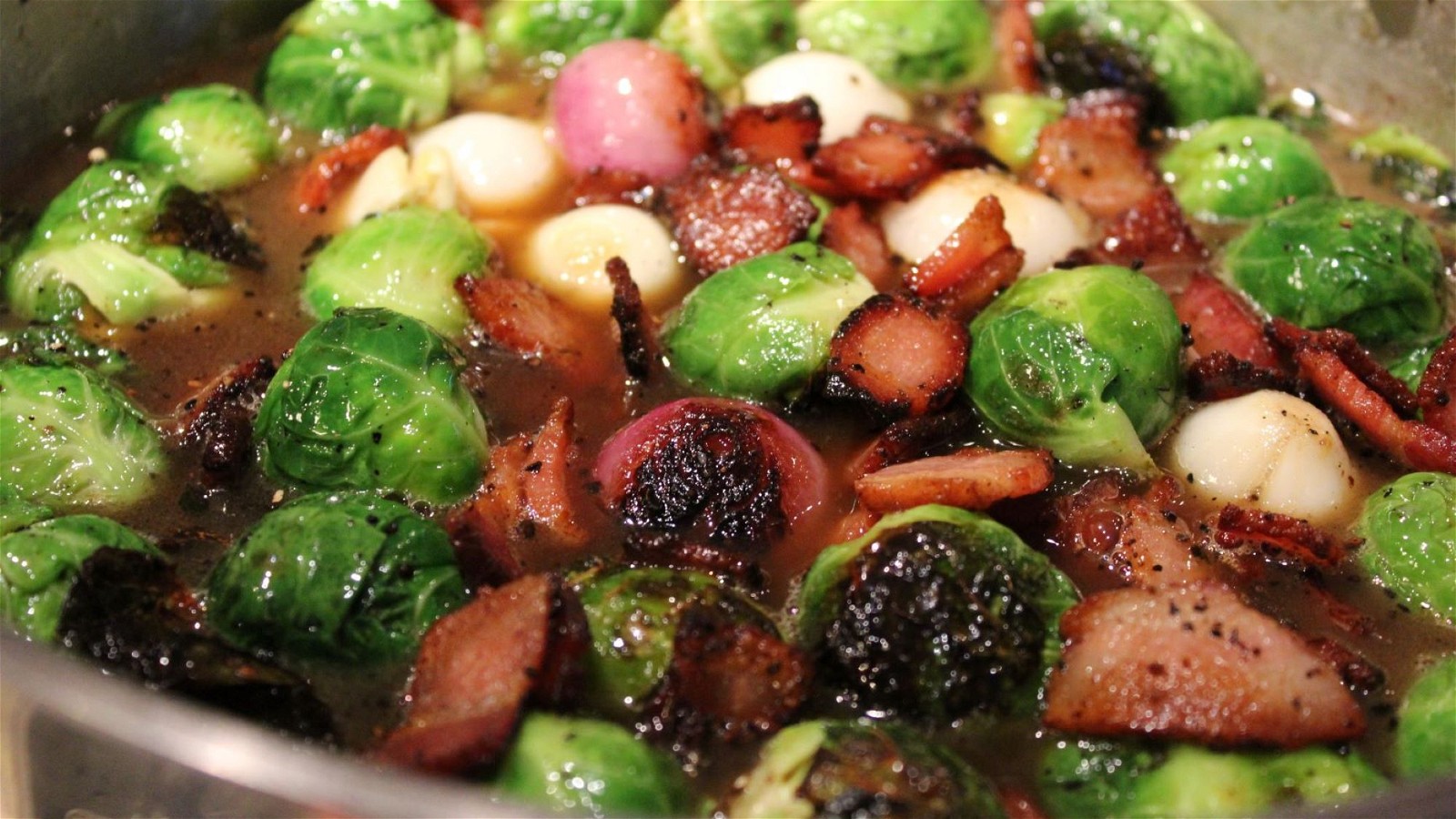 Pan cooking vegetables and bacon