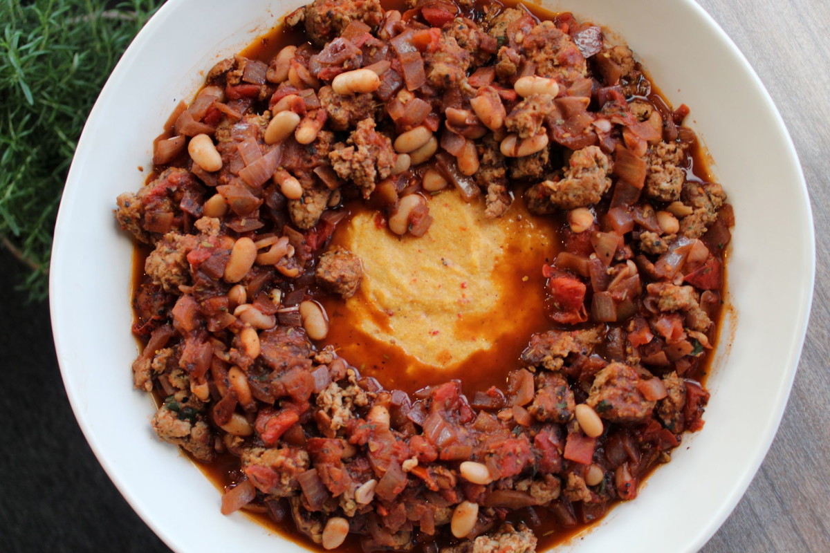 Sausage Ragout with Sundried Tomato and Basil Polenta