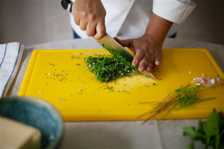 Image of Finely slice the leaves of your chosen herbs and subtly...